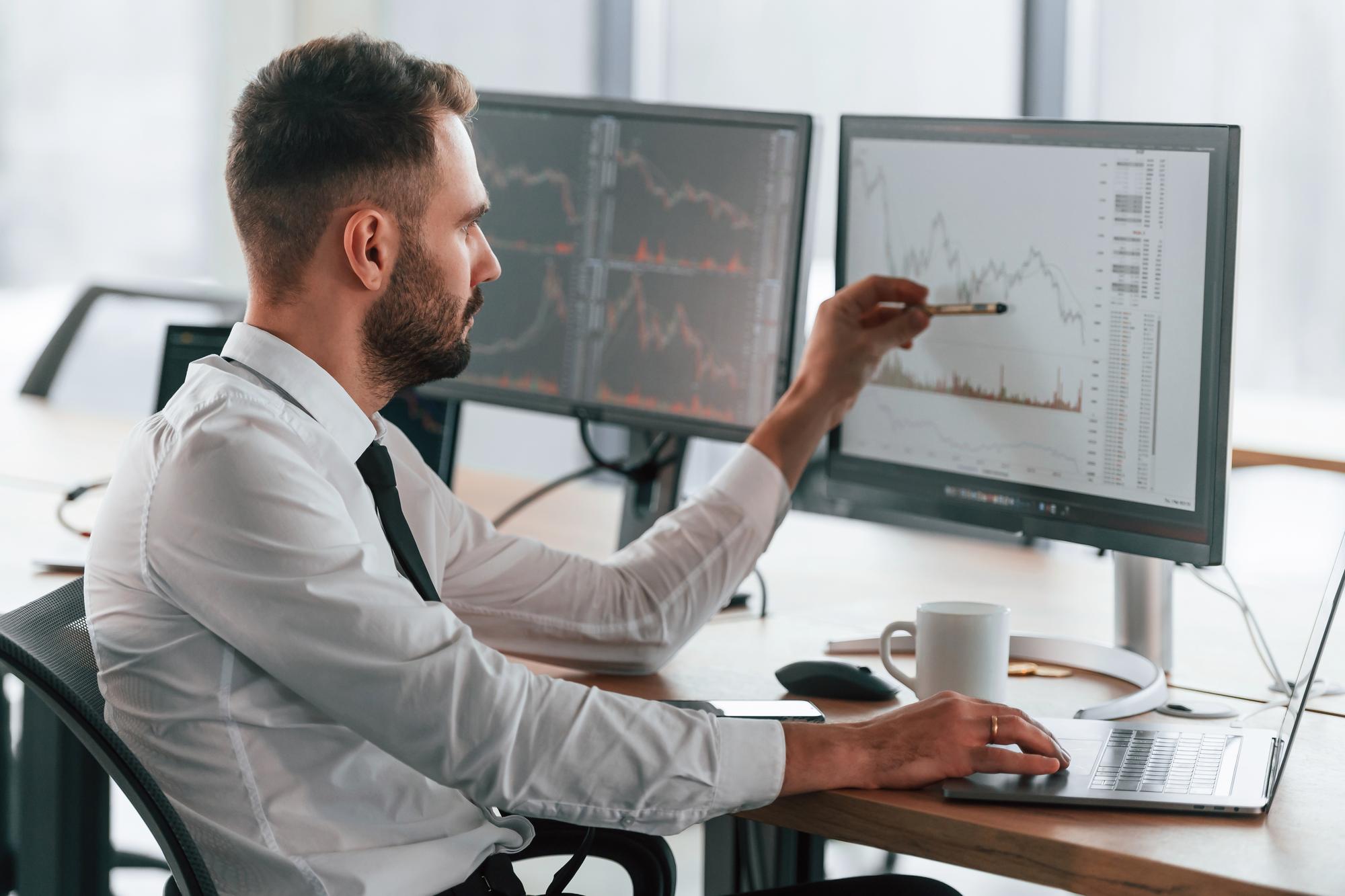 Advisor reviewing stock market charts
